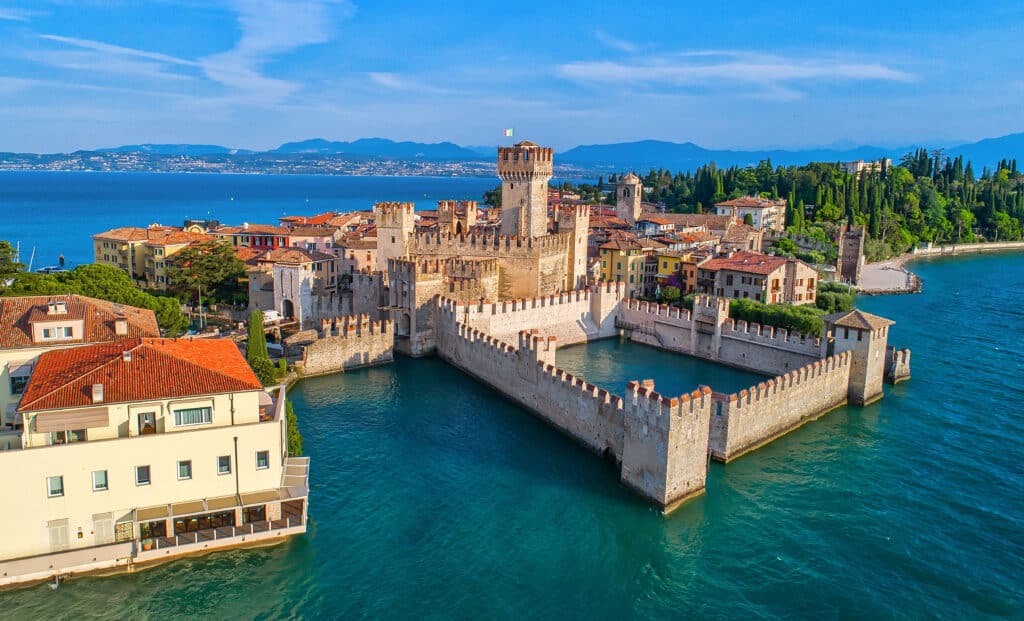 Aerial view to the town of Sirmione, popular travel destination, Lake Garda, Italy