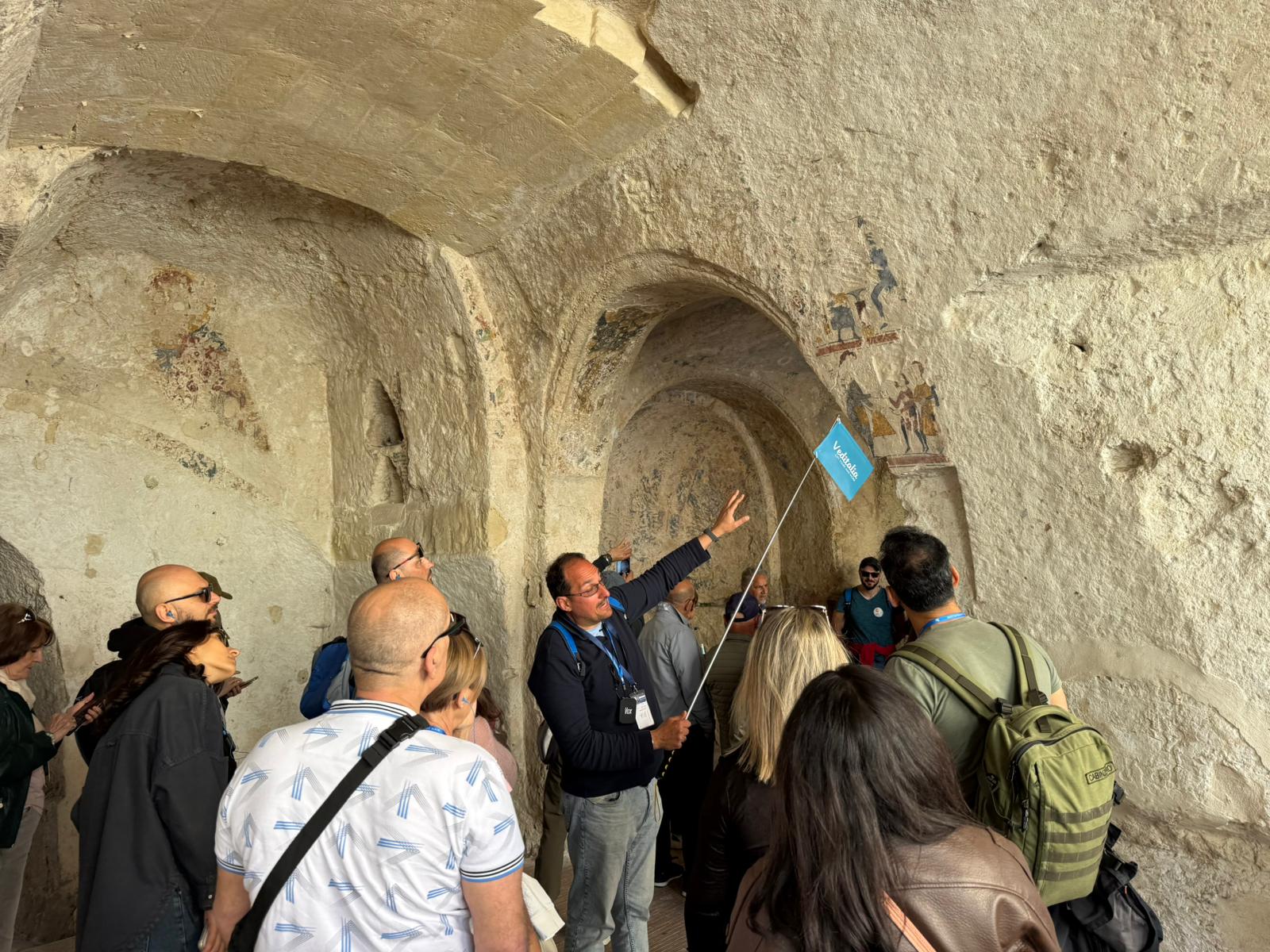 A group of tourists visiting a cave church