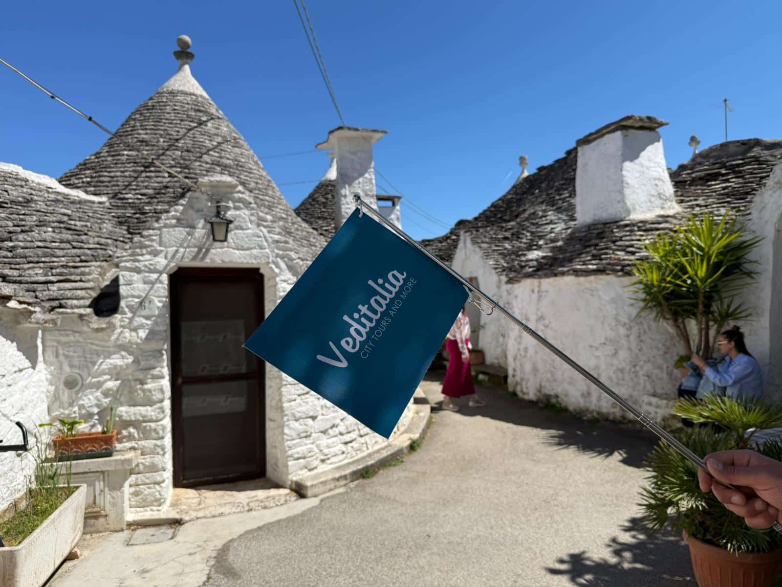 The trulli of Alberobello, historic white limestone buildings with characteristic conical roofs