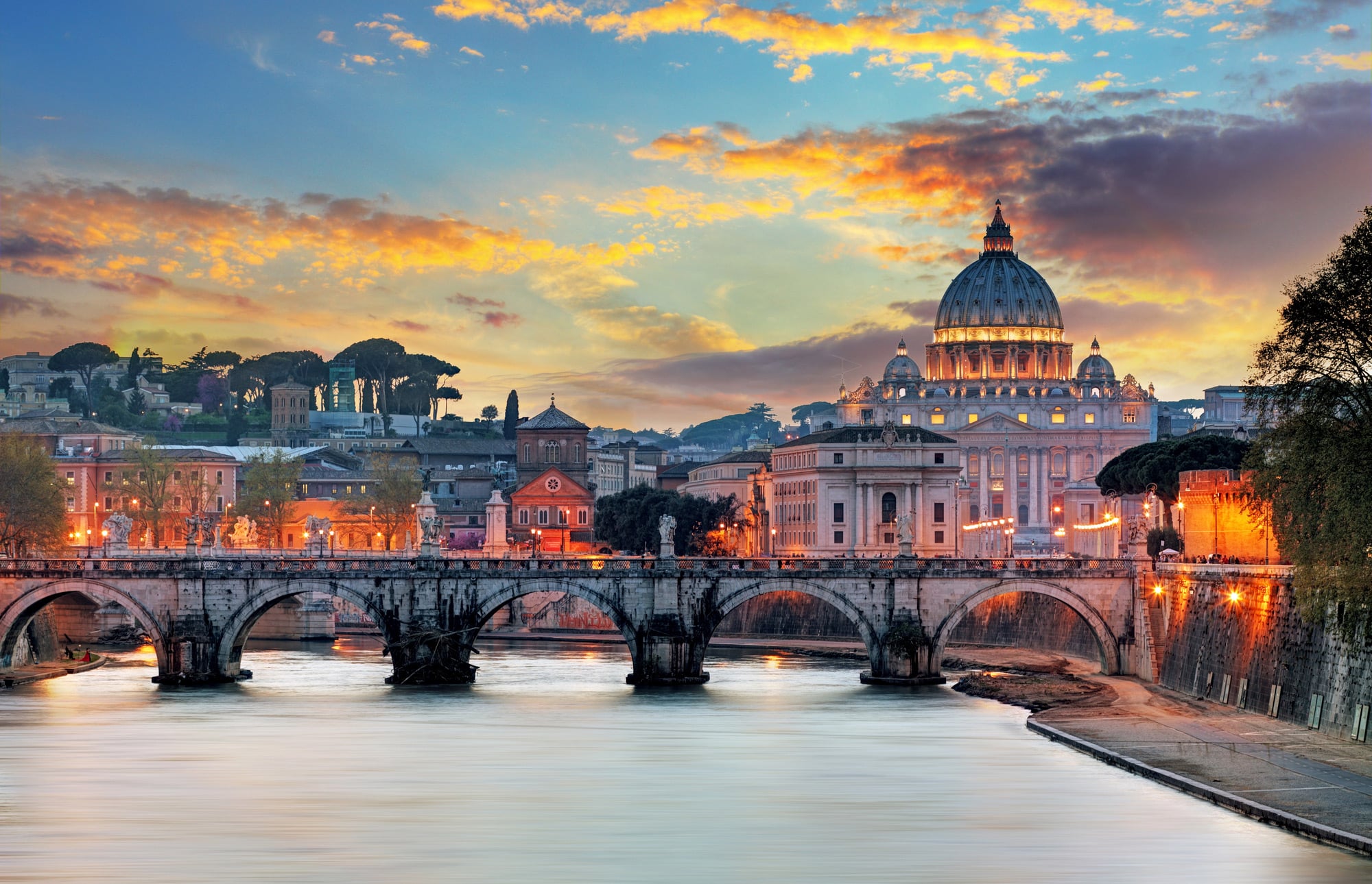 Skyline of Rome, Italy, featuring the Tiber River and St. Peter's Basilica in the Vatican City