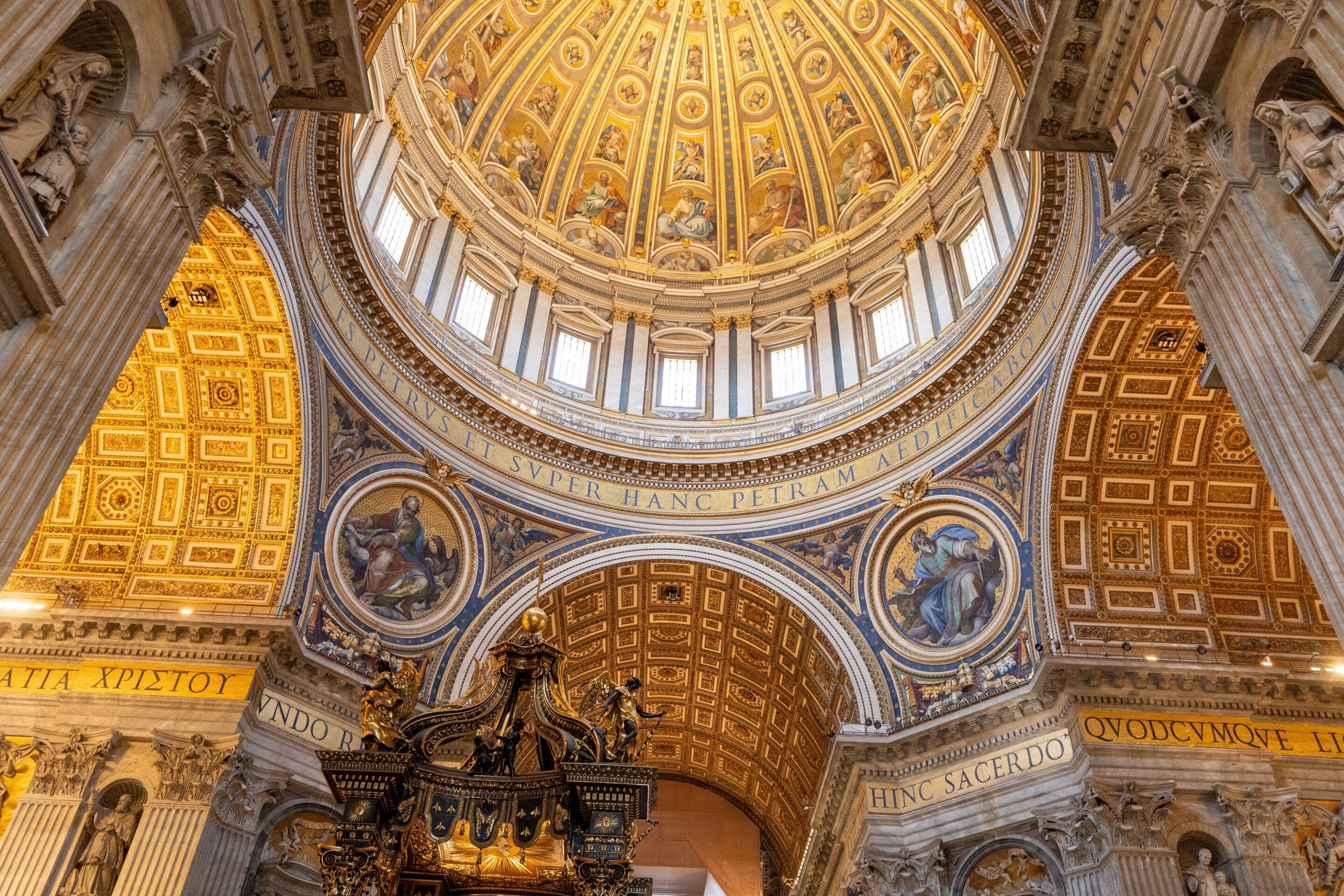 The magnificent interior looking up into the monumental dome of St. Peter's Basilica in Vatican City, designed in part by Michelangelo